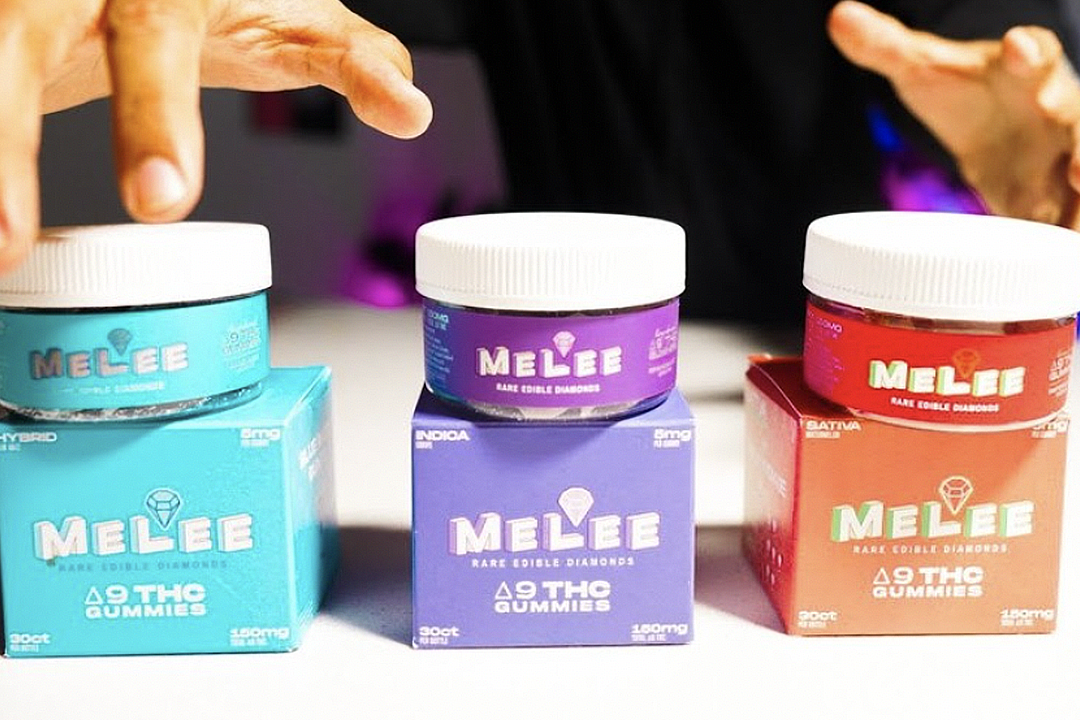 Three boxes of Delta 9 THC gummies in different colors and flavors: Blue is Hybrid, Purple is Indica, and Red is Sativa